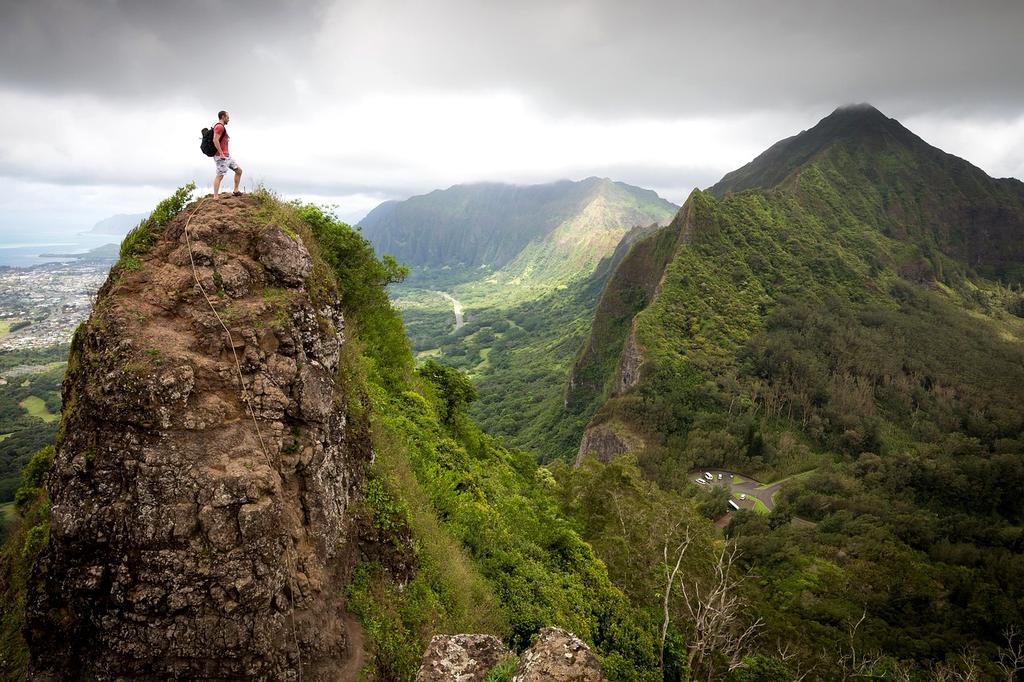 Explorer looking out over forest landscape